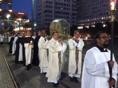 ￼Downtown Memphis: Fr. Gabriel Gillen, O.P., and other friars process with the relics of Saint Thérèse of Lisieux. Photo Credit: Karen Pulfer Focht