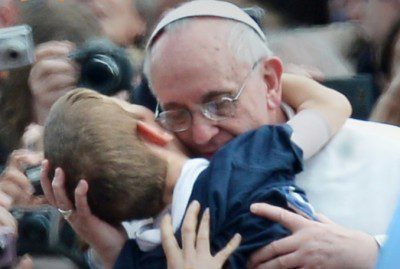 Pope Francis embracing Dominic Gondreau, who has cerebral palsy. © AFP