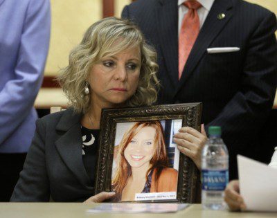 Debbie Ziegler holds a photo of her daughter Brittany Maynard, who moved to Oregon to legally end her life last fall.  (Rich Pedroncelli/Associated Press)