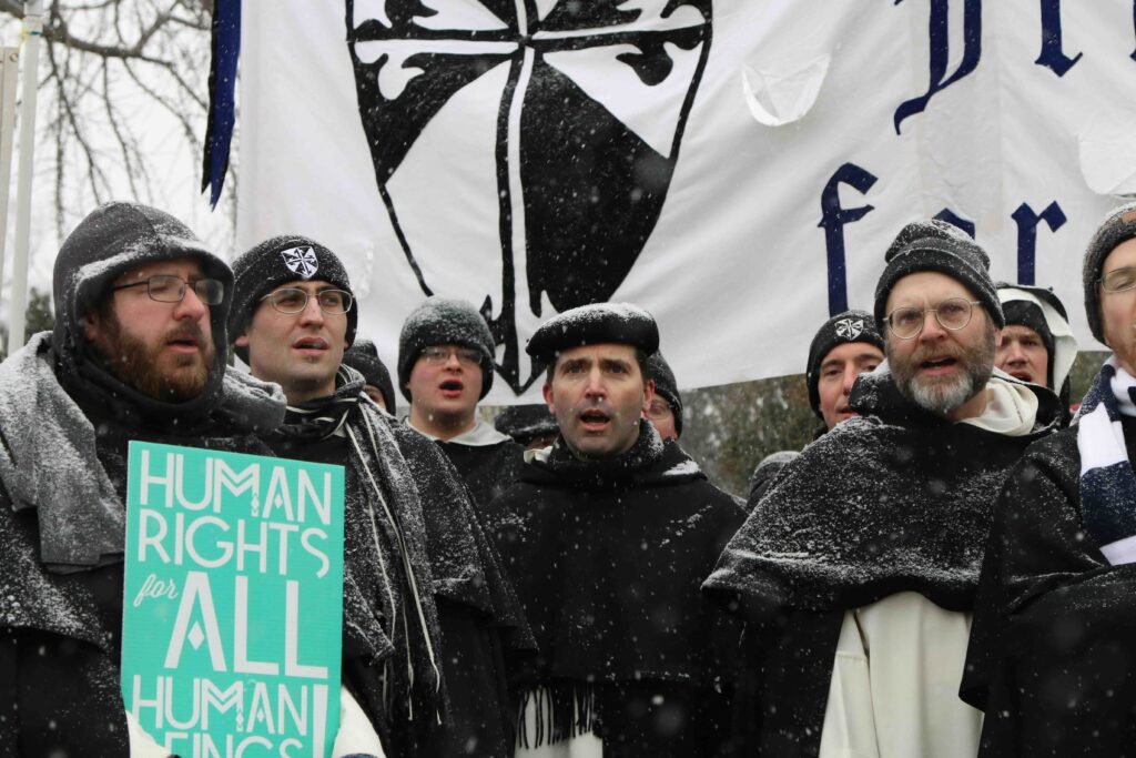 Br. Peter Gautsch, O.P., (2nd from left) and friars singing a hymn at the March for Life