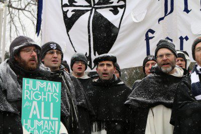 Photo by Fr. Lawrence Lew, O.P. Br. Peter Gautsch, O.P., (2nd from left) and friars singing a hymn at the March for Life