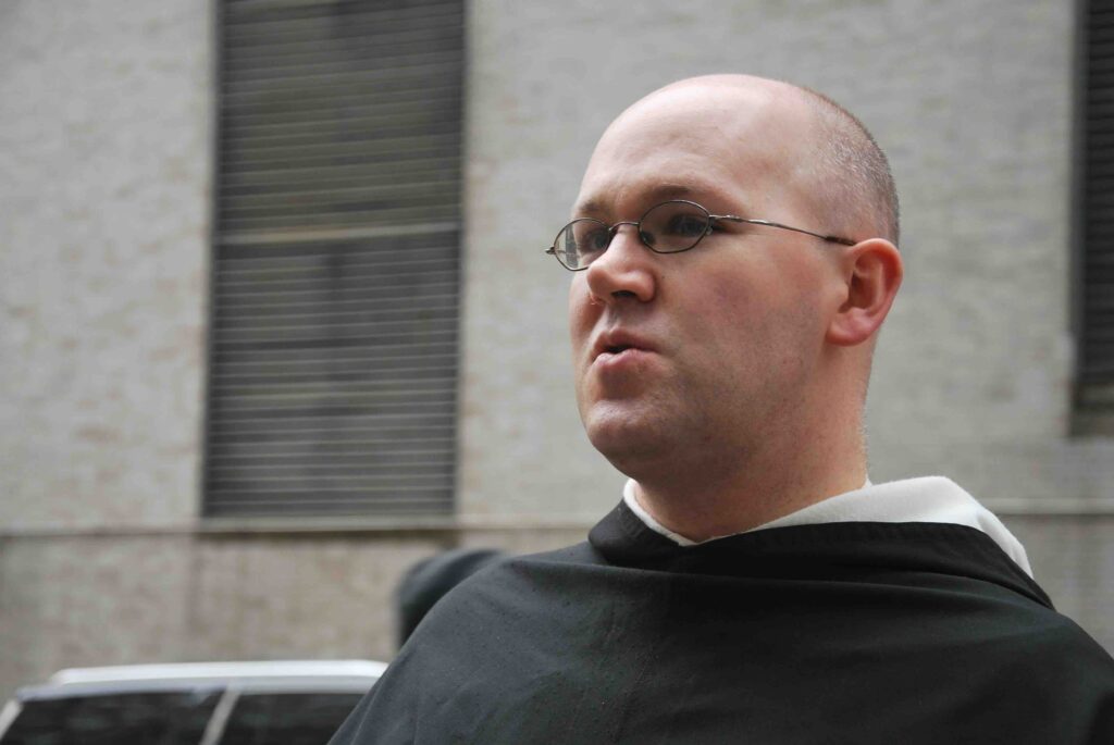 Fr. Jonah Pollock, O.P., stands outside Hospital for Special Surgery.