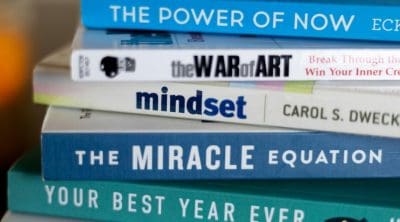 A stack of self help books with their titles showing