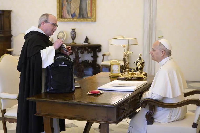 Dominican Father Thomas Joseph White handing Pope Leo XIV albums of the Hillbilly Thomists